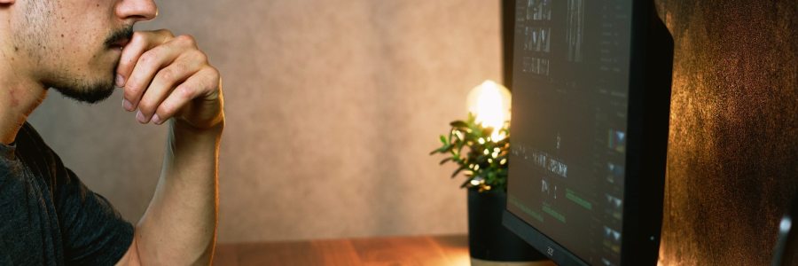 man looking at computer
