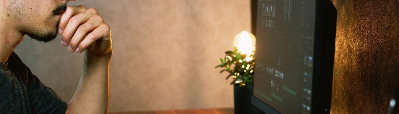 man looking at computer