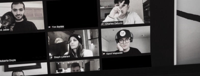 A photo of a laptop during a Zoom call where three of the participants have black boxes for their video feed because they have left their cameras off